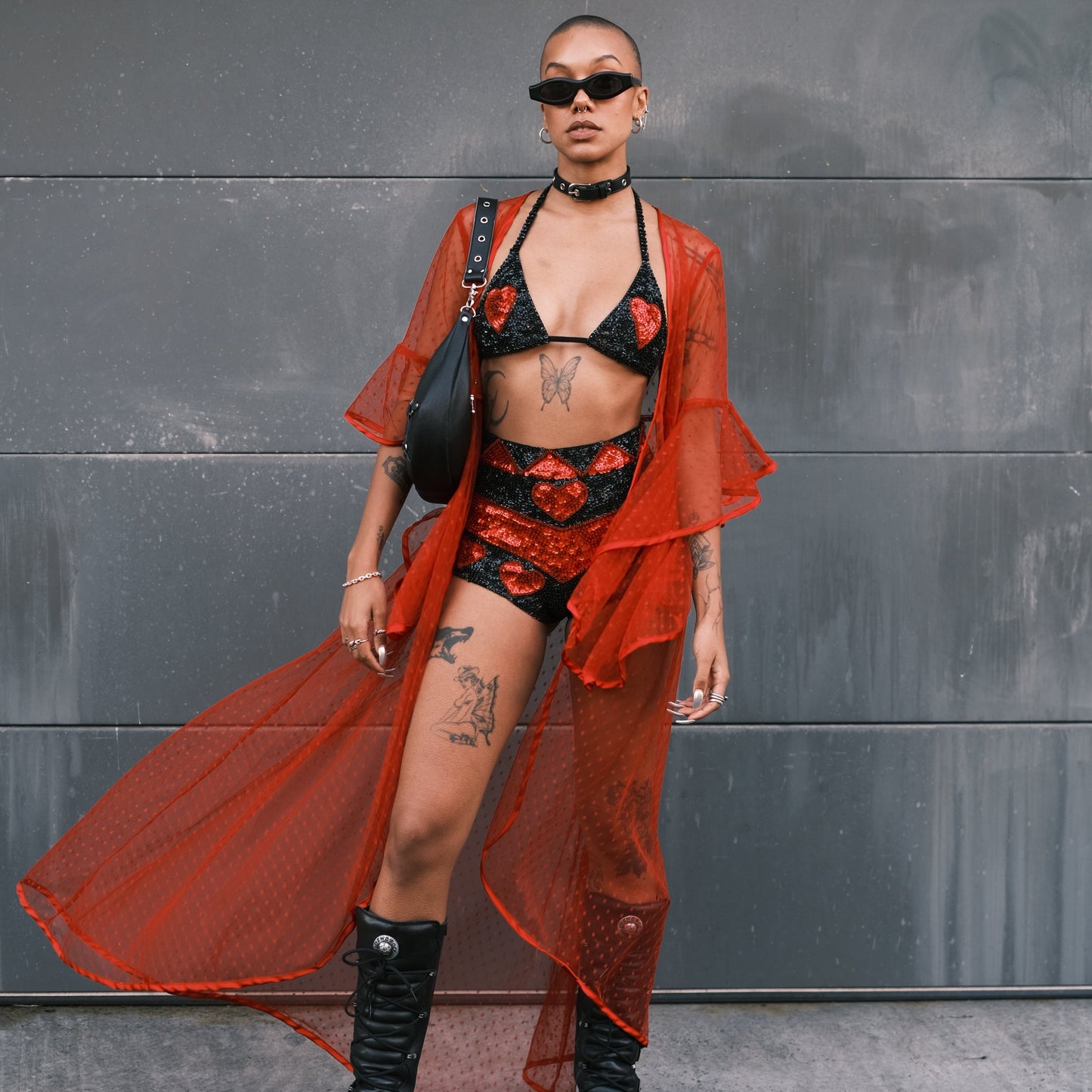 Festival-ready handmade sequin hot pants in black and red with love heart patterns. Pairs perfectly with a matching crop top for events like Burning Man and EDC.