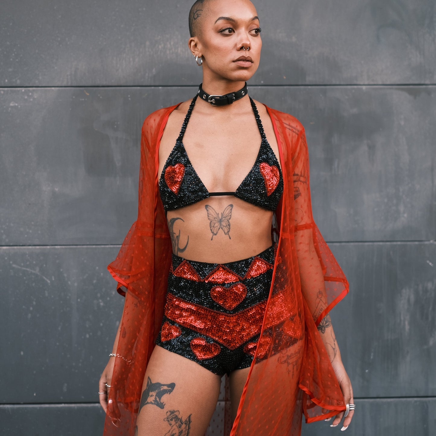 Festival-ready handmade sequin hot pants in black and red with love heart design. Ideal for Burning Man and Shambhala, pairs with matching crop top.