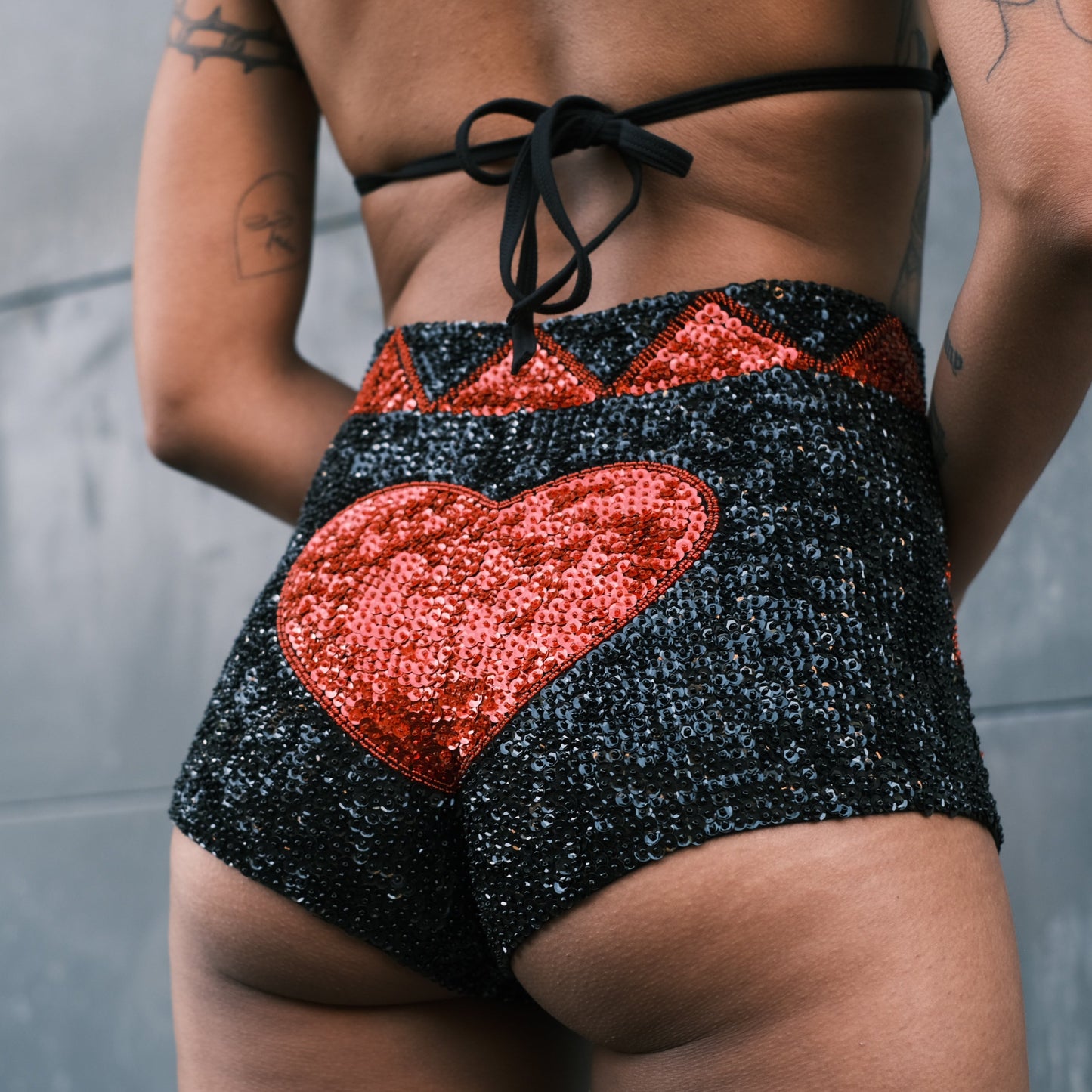 Handmade sequin hot pants featuring black and red sequins and love heart design. Great for festival wear, especially at Burning Man and Shambhala. Matches with a crop top.