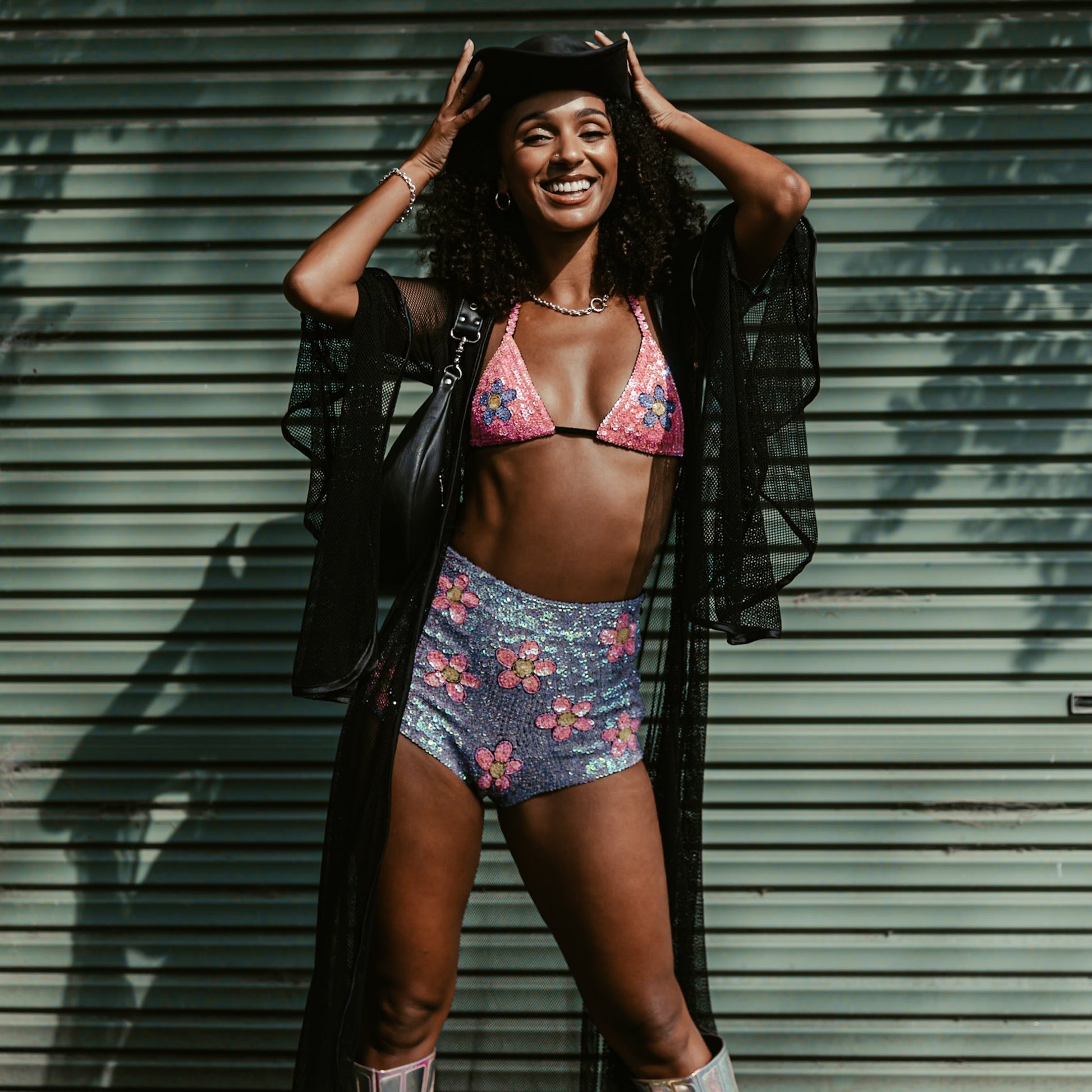 Vibrant pink and purple handmade hot pants with floral sequin details. Perfect for making a statement at festivals or as a unique Taylor Swift concert outfit.