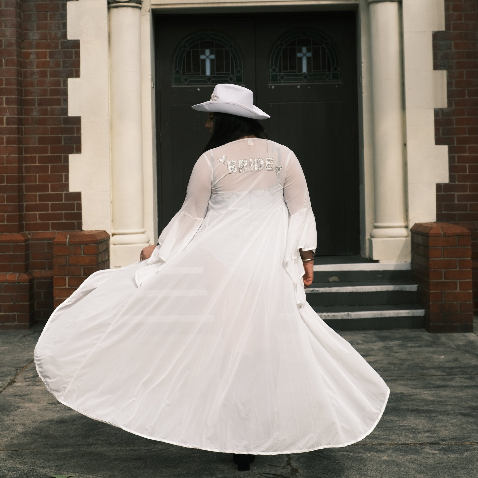 Handmade ivory mesh bridal kimono featuring hand-beaded 'Bride' in sequins on the back. A perfect hens party outfit, ideal for bachelorette celebrations, bridal showers, and a luxurious bride gown for the morning of the wedding.