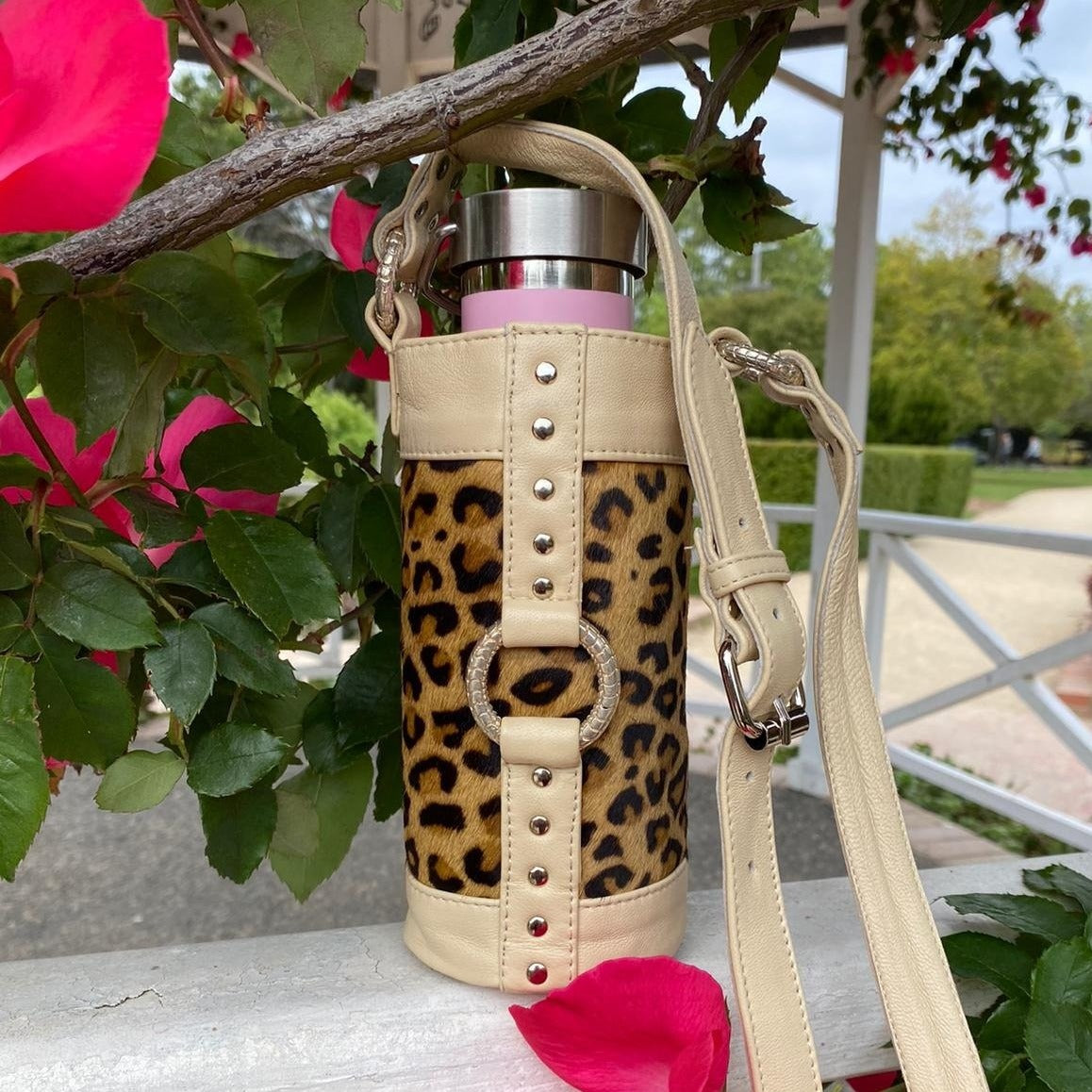 Hand made high quality cream leather and leopard print bottle bag, carry your reusable water bottle or wine bottle, wear to your next festival, rave, dance party or whilst travelling or hiking.
