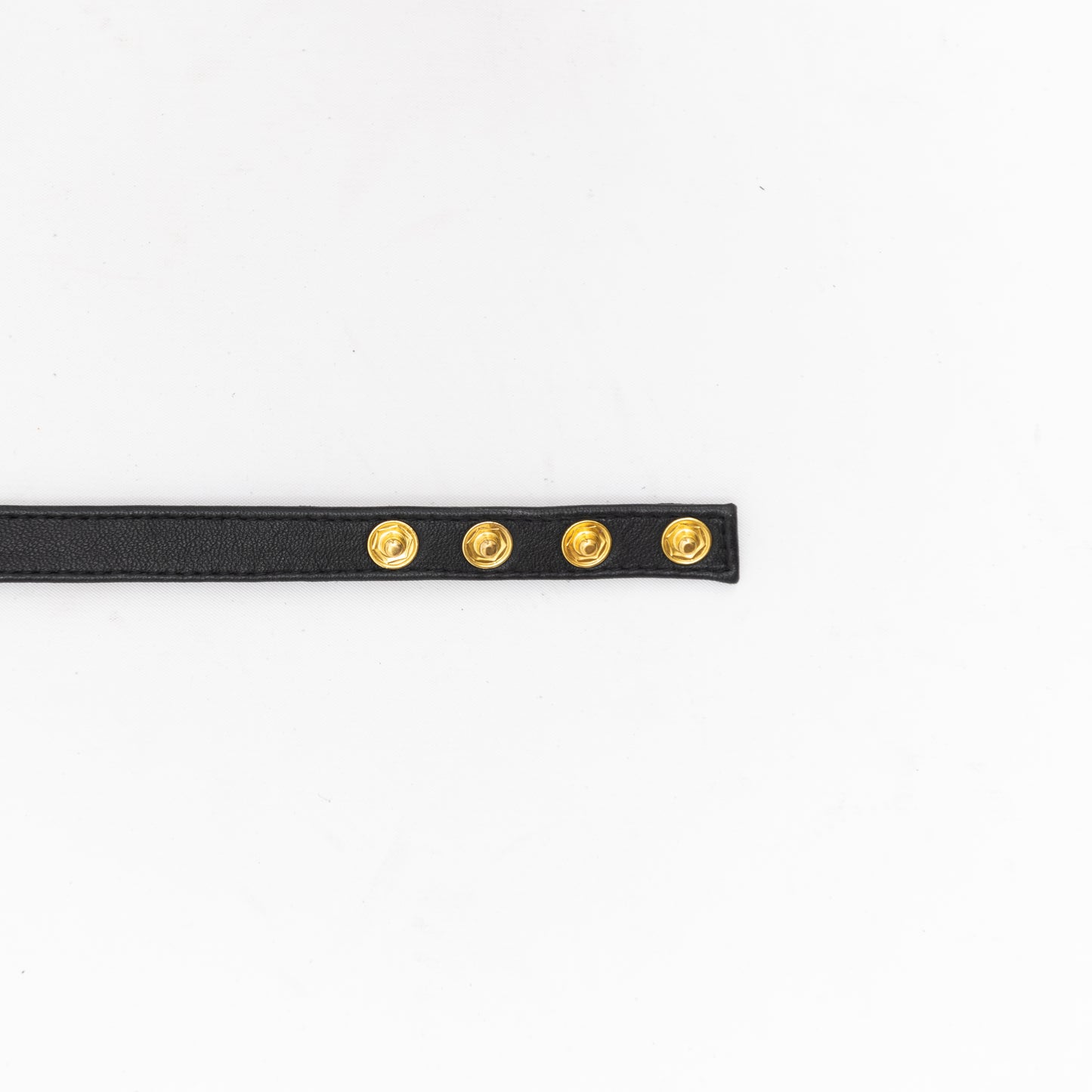 end of black leather handmade choker with button closure.