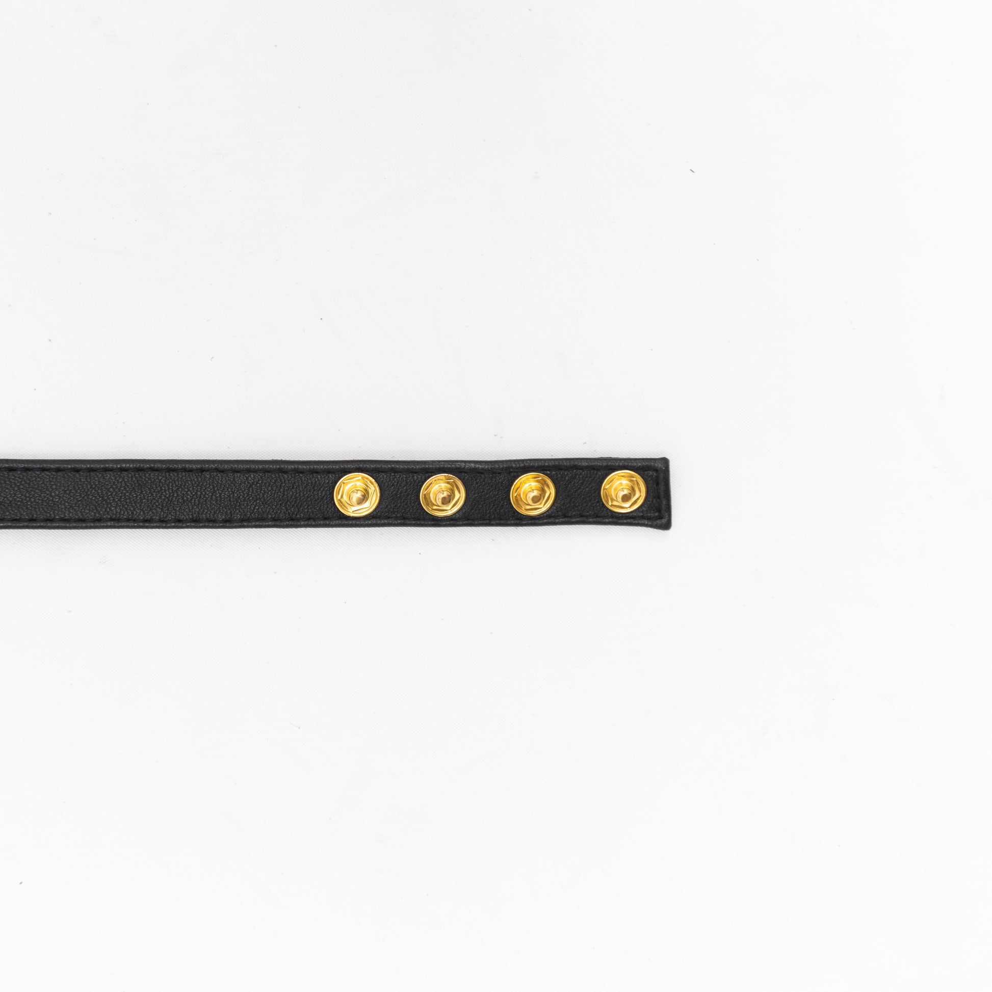 end of black leather handmade choker with button closure.