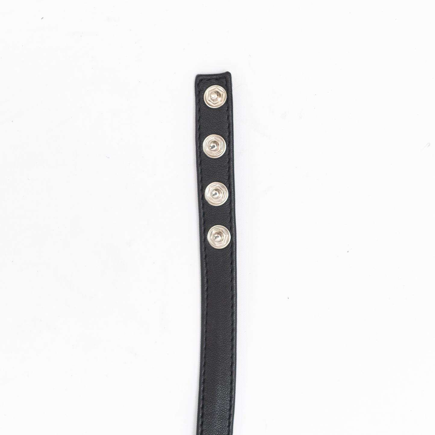 close up of end of our black leather handmade choker with button closure.