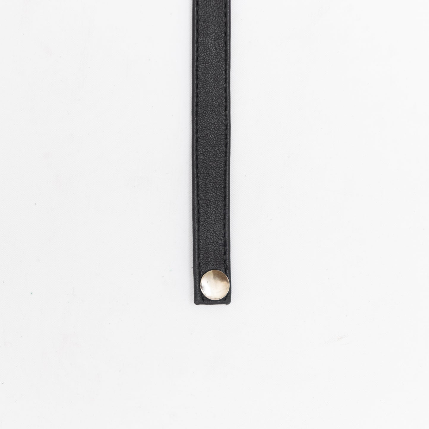 hand made leather choker with silver hardware and button closure.