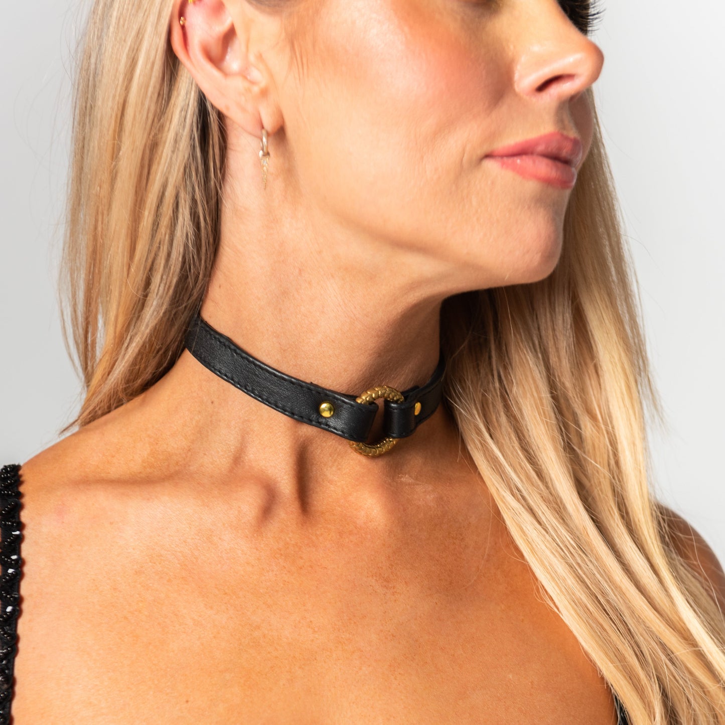 handmade black chunky leather choker necklace for rave outfit, festival style or bondage.