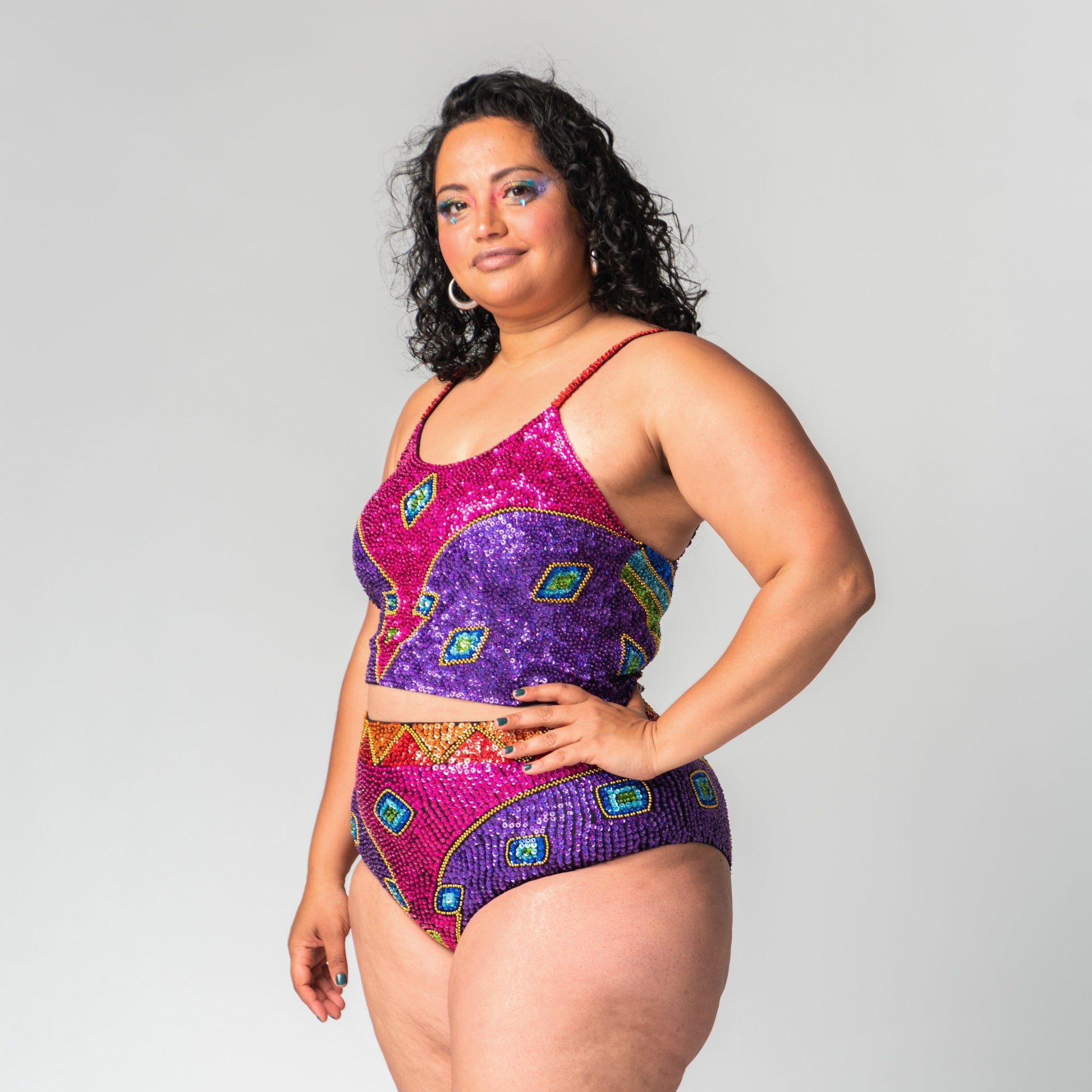 matching rainbow crop top and high waist bottoms for festival outfit or gay pride costume.