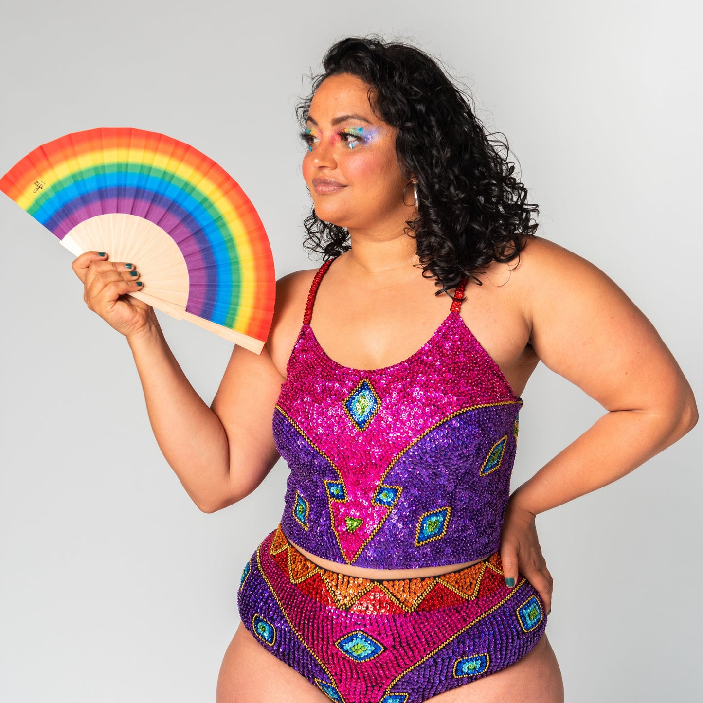 rainbow festival crop top with pink, purple, blue, green, red, orange, yellow and green sequins, for festival outfits.