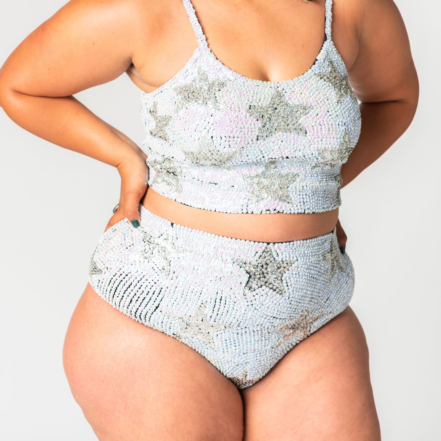 Pearl white and holographic silver sequin hot pants with stars for festival shorts and matching crop tops outfits.