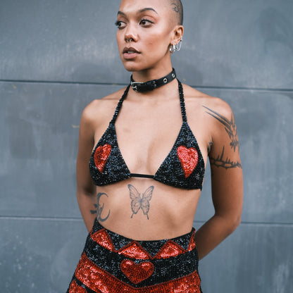 Festival-ready crop top with handmade black and red sequins and heart designs on the breasts. Ideal for pairing with matching hot pants at Burning Man and EDC.