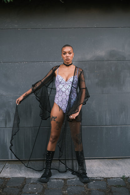 Elegant black mesh kimono with gold sparkle details, perfect for festival outfits. Soft, bouncy, and sexy design makes it an ideal duster for making a bold festival statement.