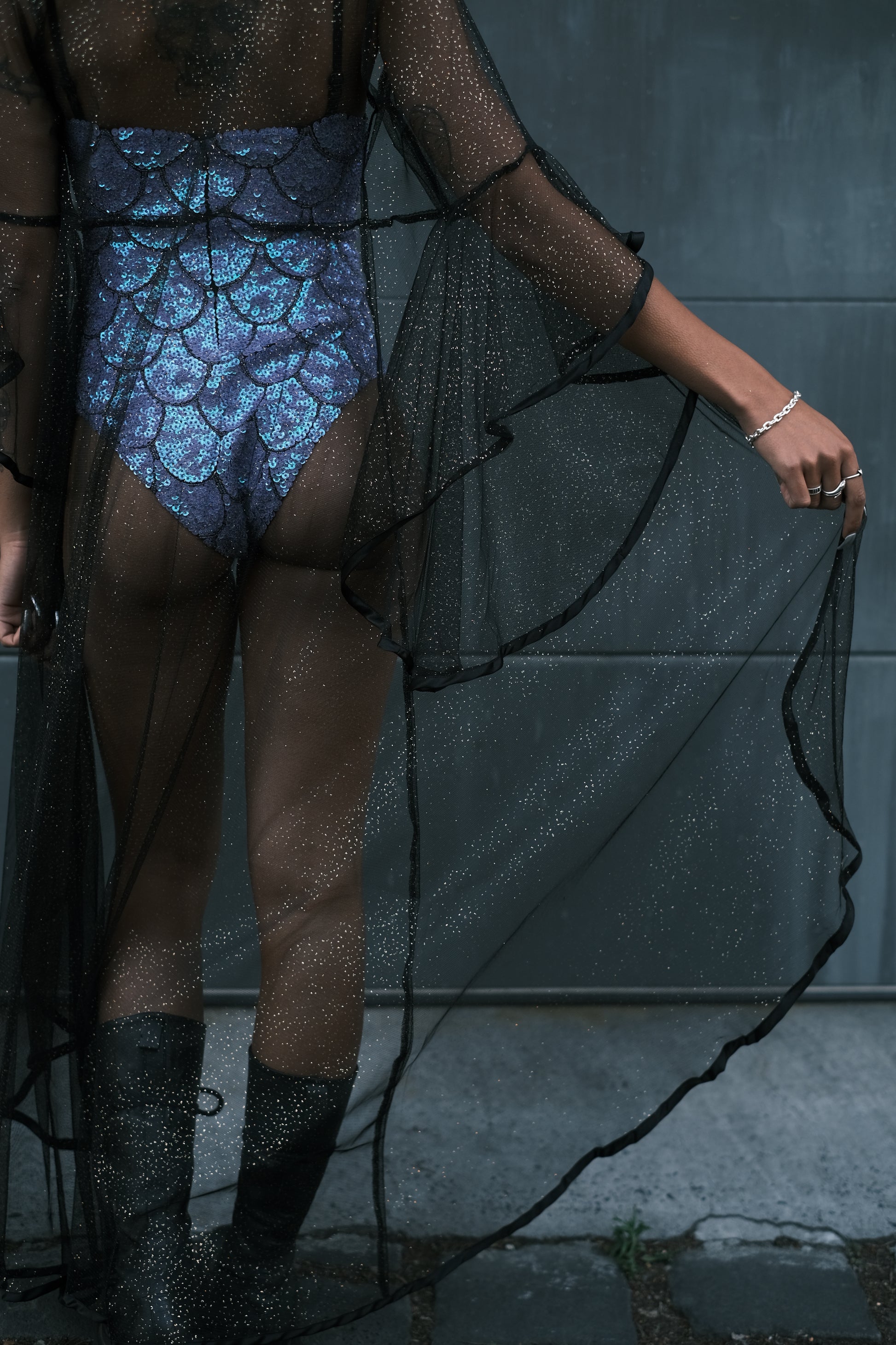 Glamorous black mesh kimono with gold sparkle details. Soft and comfortable with a bouncy, sexy design, perfect for enhancing alt fashion looks and festival outfits.