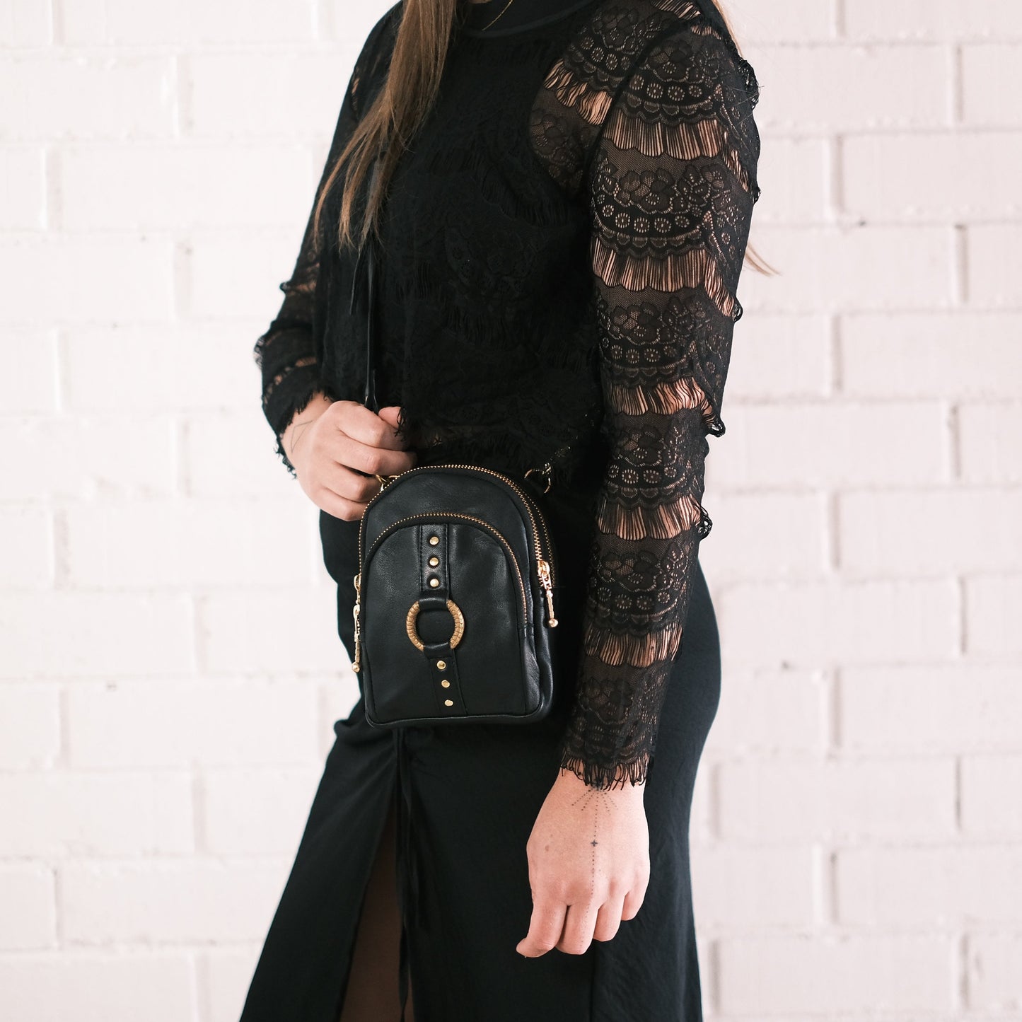 black leather cross body bag for festival outfit with gold hardware