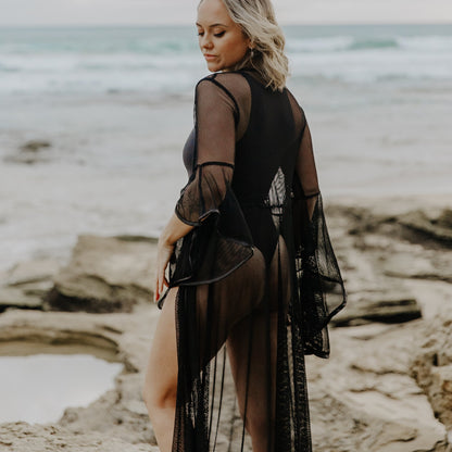 Fishnet kimono ideal for Austin City Limits and Burning Man. Perfect for layering over festival outfits to create a bold, fashionable statement.