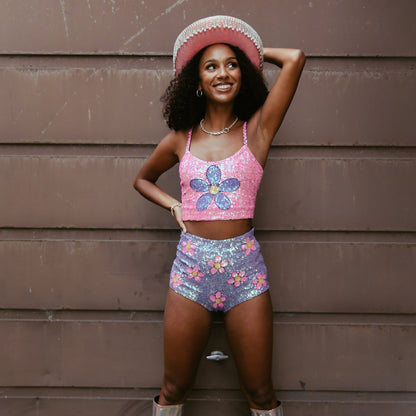 Handmade crop top featuring vibrant pink and purple with floral sequin accents. Great for making a statement at festivals and as part of Taylor Swift Eras Tour outfit ideas. Soft and fashionable.