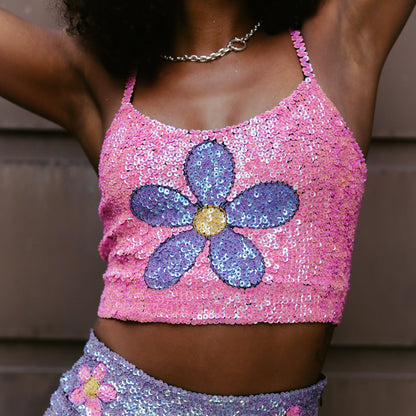 Handmade crop top featuring vibrant pink and purple with floral sequins. Perfect for enhancing festival outfits and as a stylish choice for Taylor Swift Eras Tour outfit ideas. Soft and eye-catching.