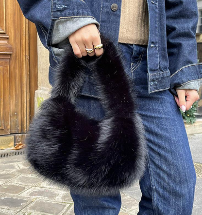 Faux fur handbag in plush black, adding a playful and funky touch to any wedding or festival look