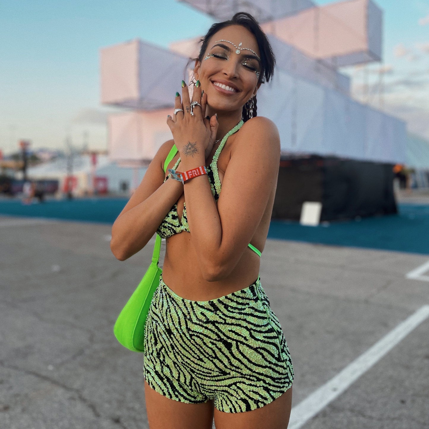 festival outfit with green and black zebra print matching set and green accessories, festival makeup and hairstyle
