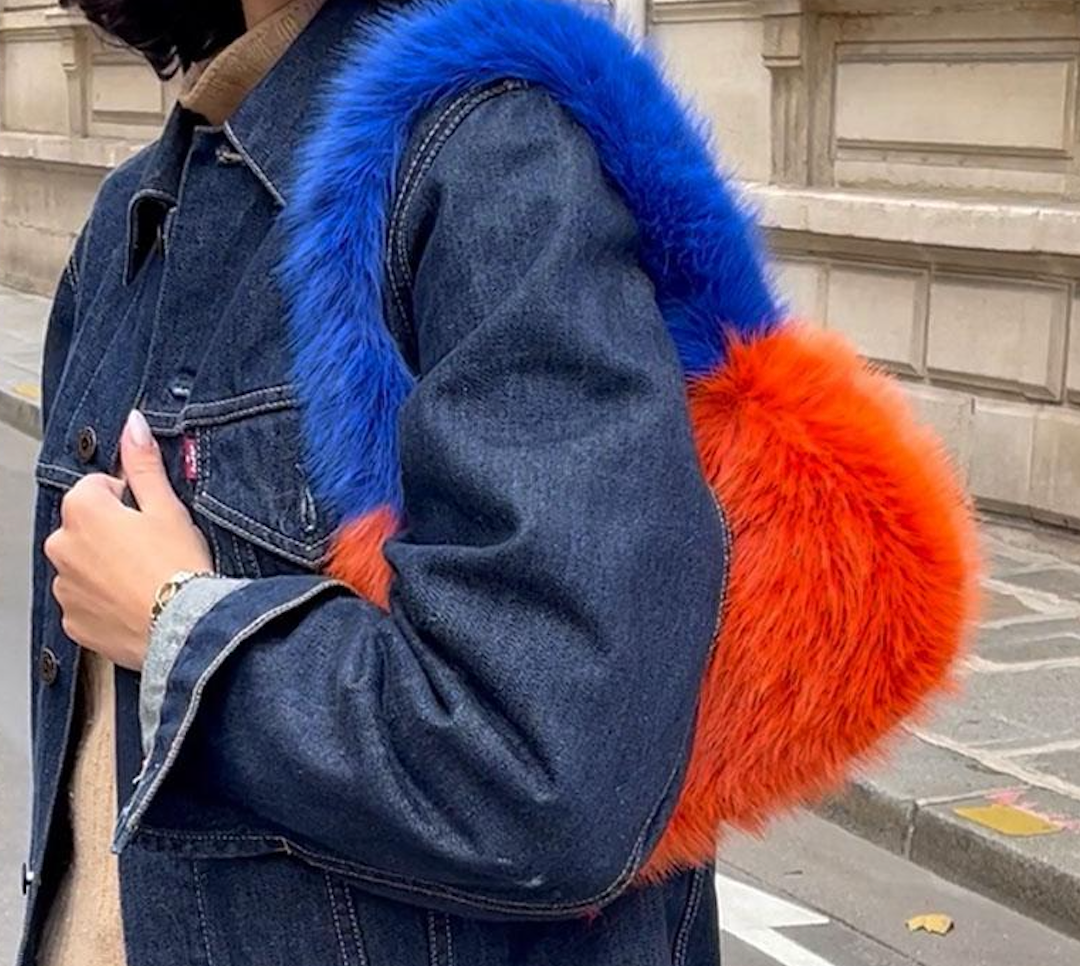 Faux fur handbag in striking blue and orange, adding a playful and funky touch to any wedding or festival look