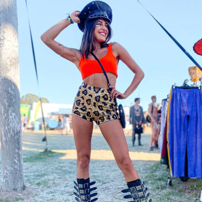 Rave girl at pitch music and arts festival, wearing our ziji the label sequin shorts, rave boots and festival hat, festival outfit perfect for your next day party of event, stand out festival look, rave outfit, rave style, doof wear, doof boots, australian festival.