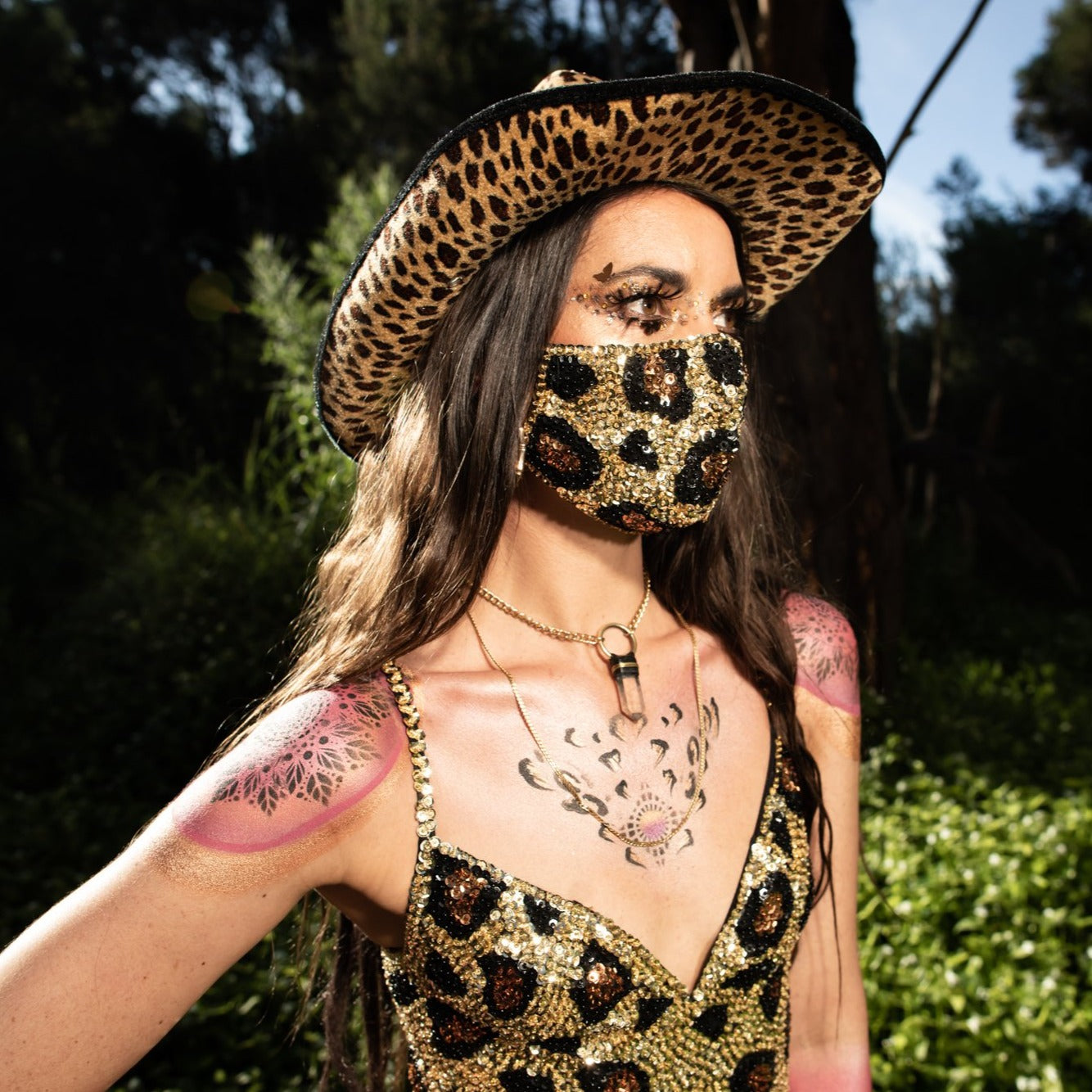 Help protect yourself from Covid-19 variants (as well as dust, wind and the sun) at your next festival with these outdoor-ready face masks, made from gold brown and black sequins. Face mask for festivals and day parties. 