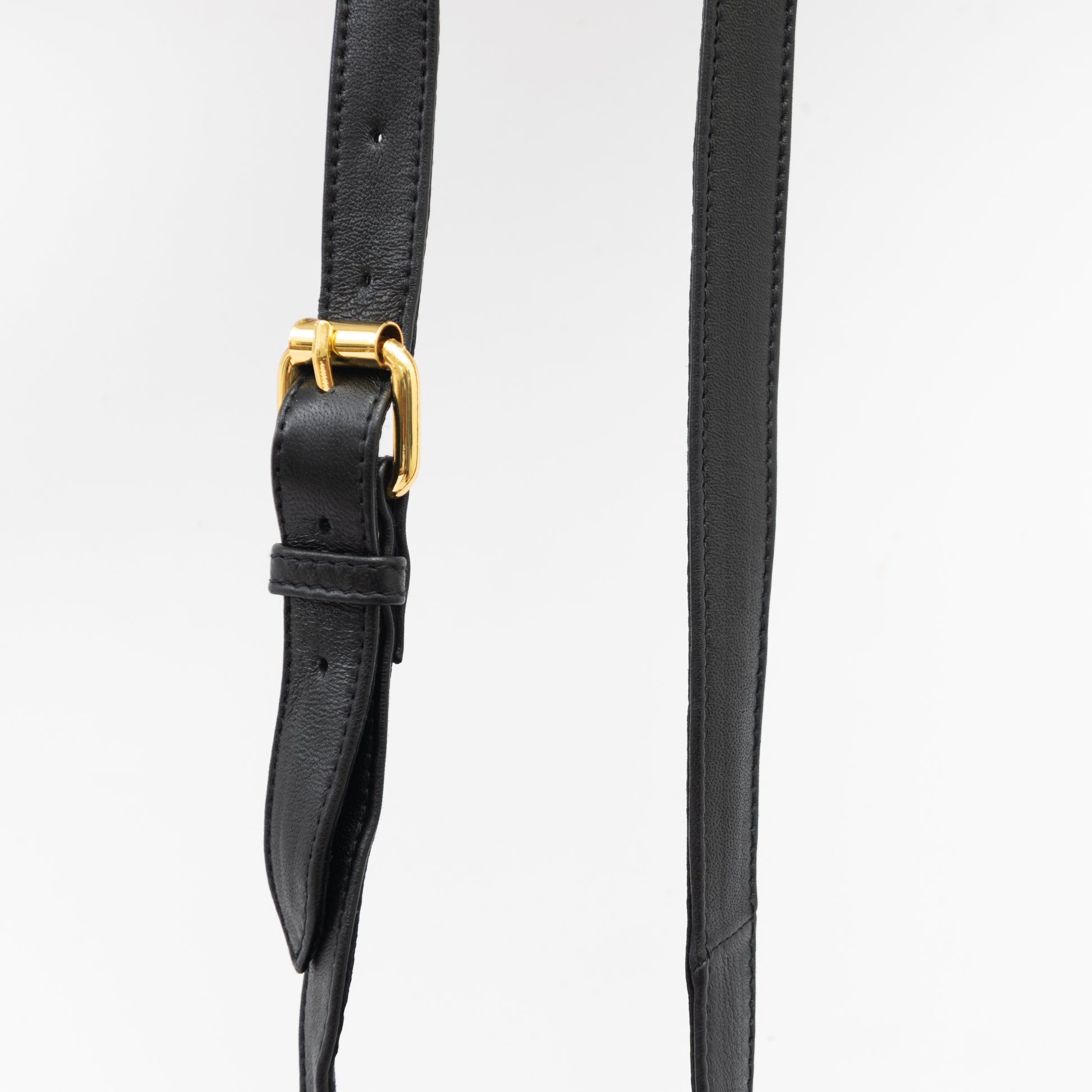 adjustable shoulder strap for black leather cross body bag with gold hardware