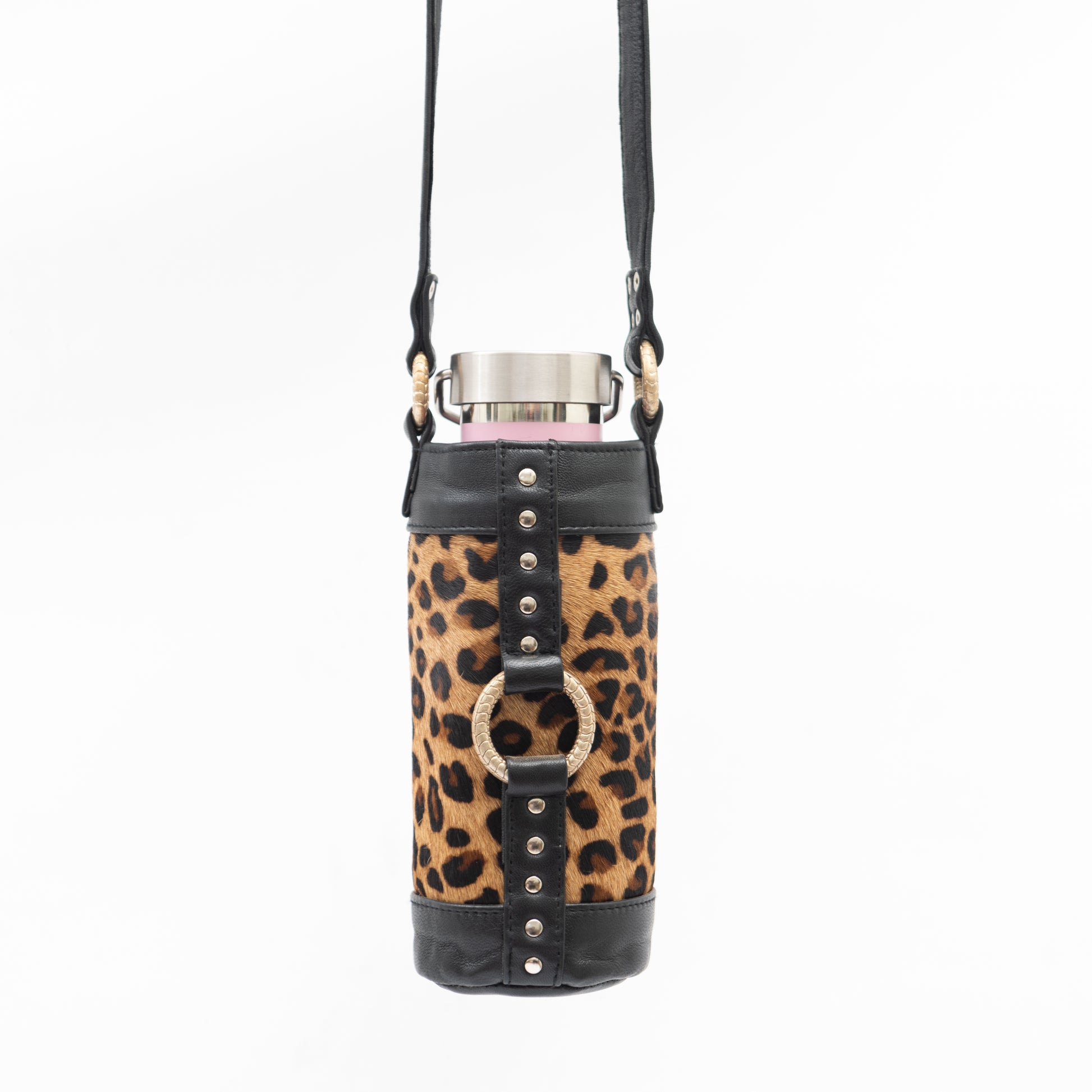 Ziji The Label, hand made black leather and leopard print bottle bag, holster, carry bag, reusable water bottle or wine bottle, festivals, events, dance parties, rave, travel, hiking, shopping, silver hardware and luxe silver rings.