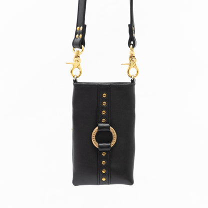 designer crossbody phone bag made from black leather with gold hardware and leopard print lining.