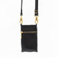 back view of black leather crossbody phone bag, showing hidden zip pocket.  