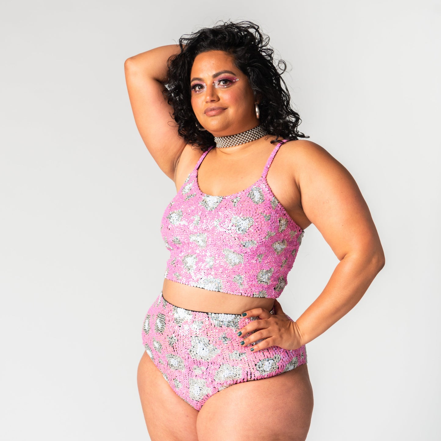 pink leopard print festival tops and bottoms on plus size model, hand made with sequins.