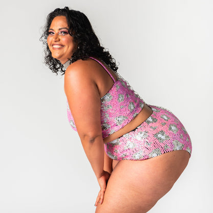 matching two piece festival set in our pink leopard print design on our plus size model.