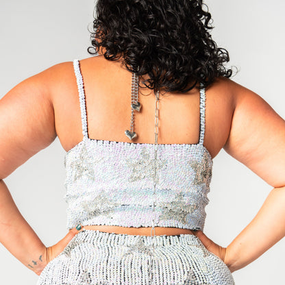 back of white and silver sequin crop top with stars for festival outfit.