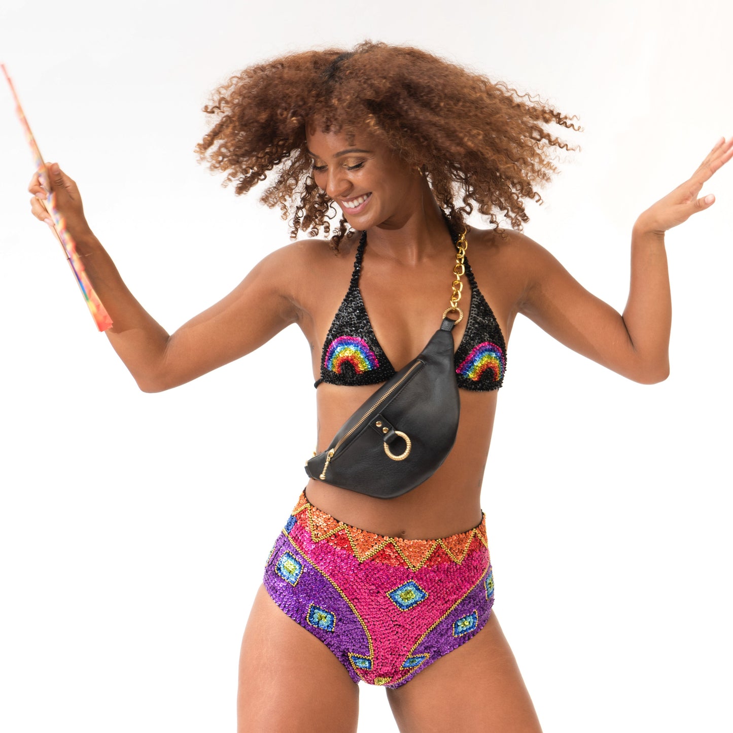 sequin music festival outfit with matching set in rainbow design and leather bumbag 