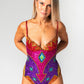 Sequin bodysuit in rainbow design for festivals, worn on size 10 model and showing front view. 