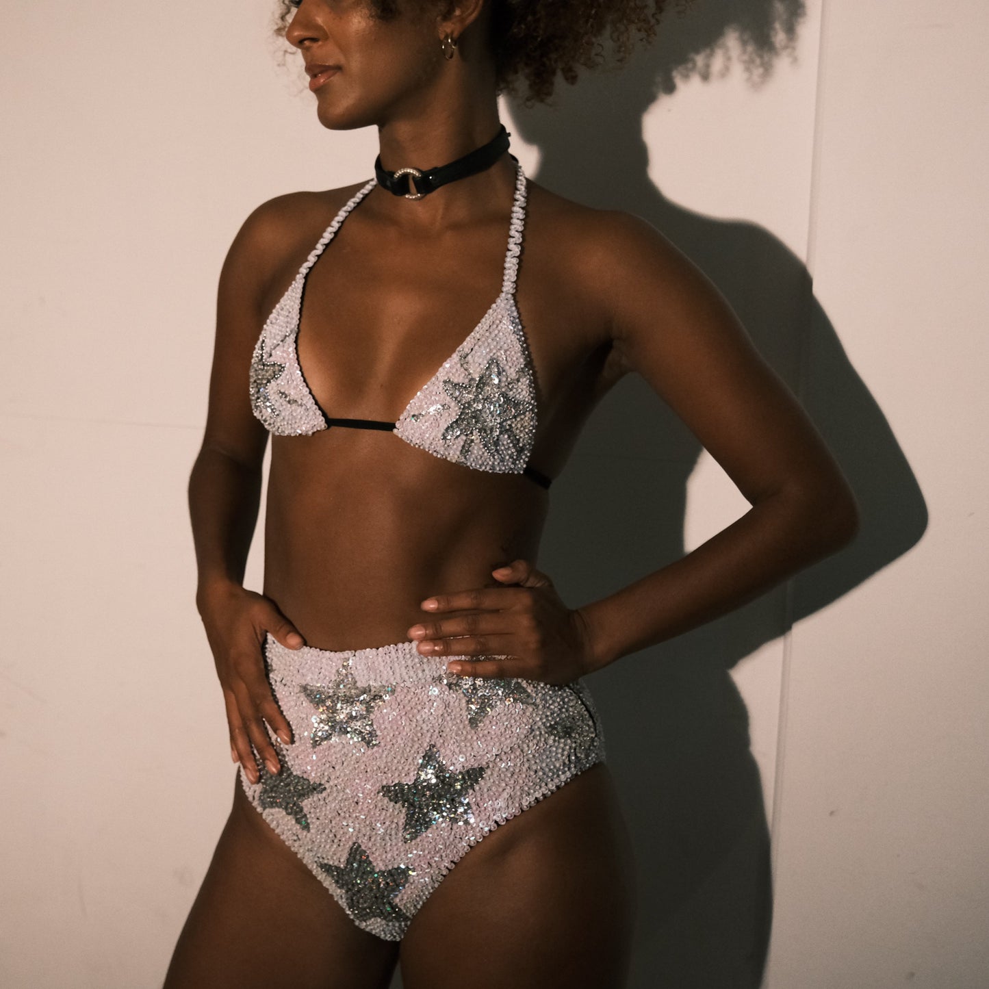 White and silver sequin bikini top with star design, handmade for hen party outfits. Ideal for adding a stylish touch to bridal party looks, festival fashion, and Henchella. Sparkly and eye-catching.