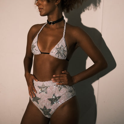 White and silver sequin bikini top with star design, handmade for hen party outfits. Ideal for adding a stylish touch to bridal party looks, festival fashion, and Henchella. Sparkly and eye-catching.