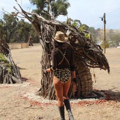 Festival Fashion, leopard print sequin hot pants, festival bottom, burning man outfit, burner girls, Coachella valley music festival fashion, outfit, booty shorts, festival boots, Australian festival fashion.