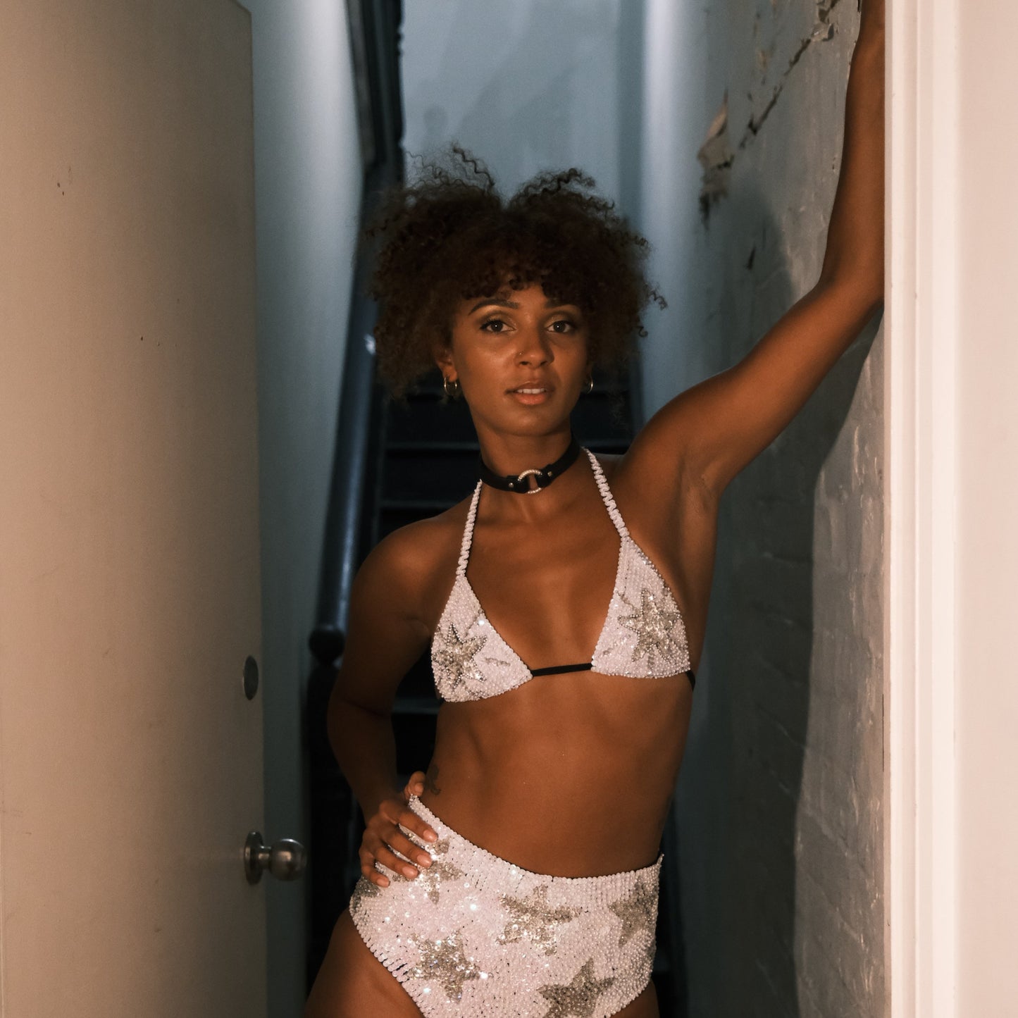 White and silver sequin bikini top with star design, handmade for making a statement at Taylor Swift Eras Tour. Ideal for festival outfits, bridal party looks, hen do outfits, and Henchella. Stylish and comfortable.